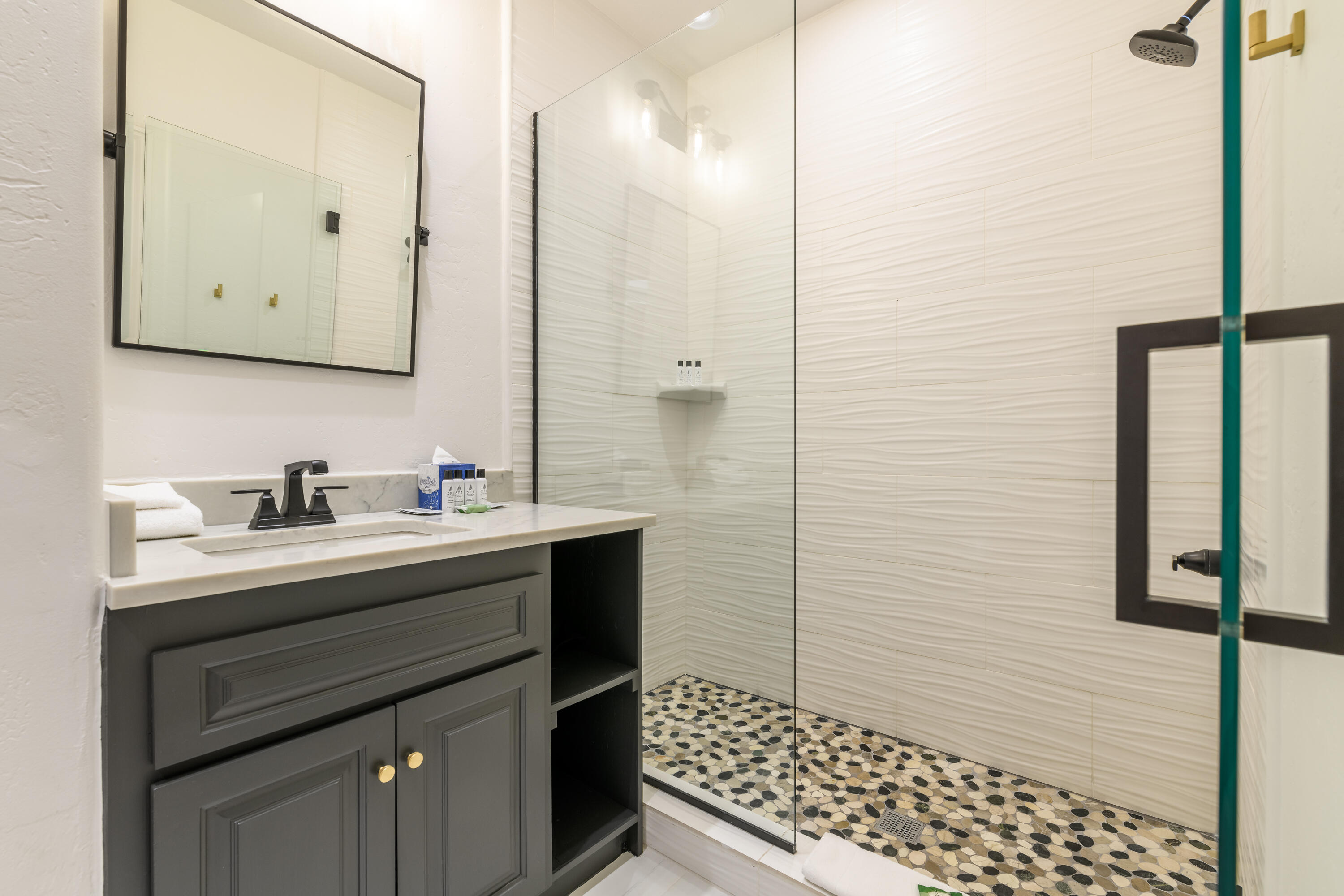 101 Sunny Ridge Place, Unit 101 Mountain Village, CO 81435 - Photo 20 of 30 a bathroom with a sink and a mirror