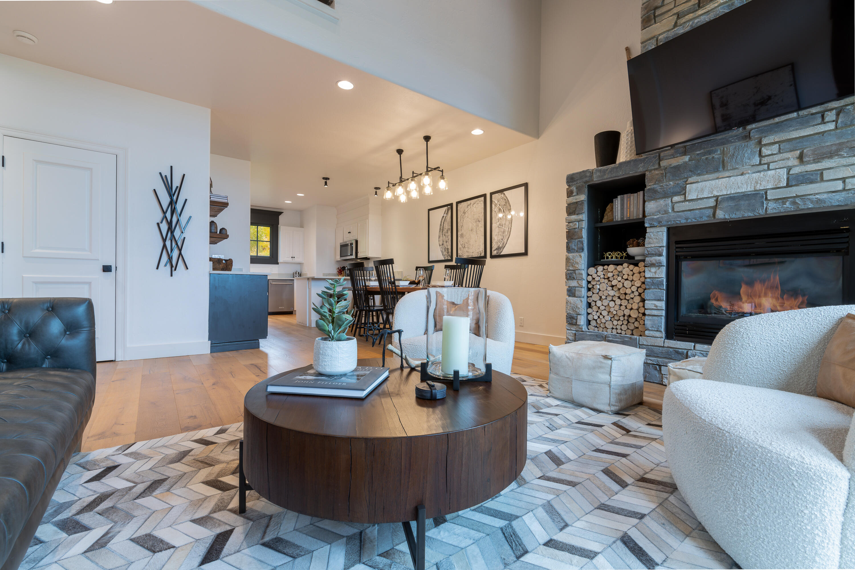 101 Sunny Ridge Place, Unit 101 Mountain Village, CO 81435 - Photo 7 of 30 a living room with furniture and a fireplace
