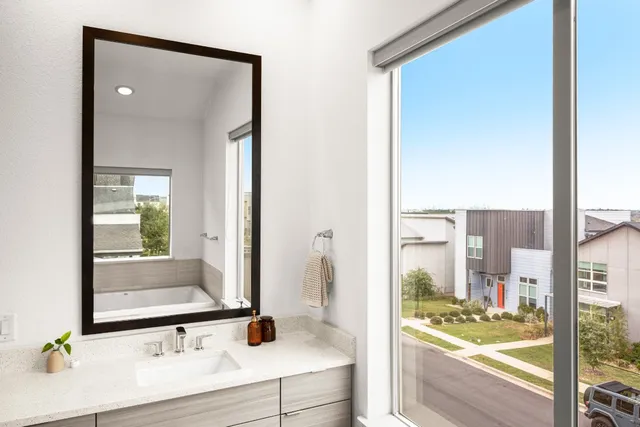 a bathroom with a bathtub and a shower