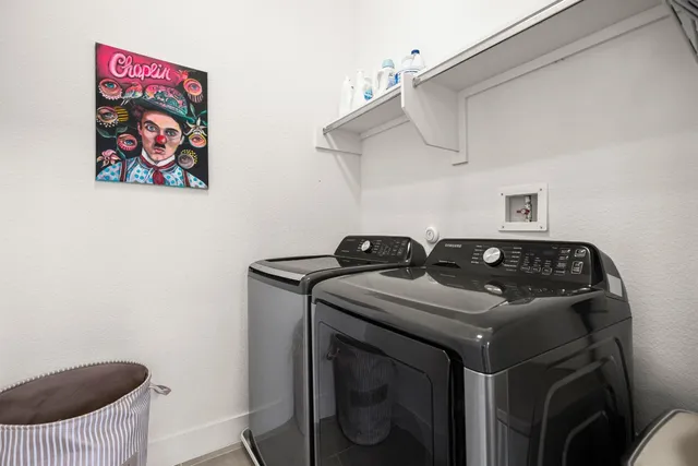 a bathroom with a tub double vanity sink and mirror