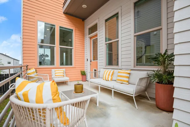 a view of two chairs in the balcony