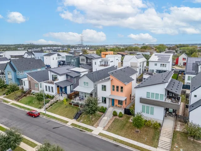 a view of a house with a yard and garage