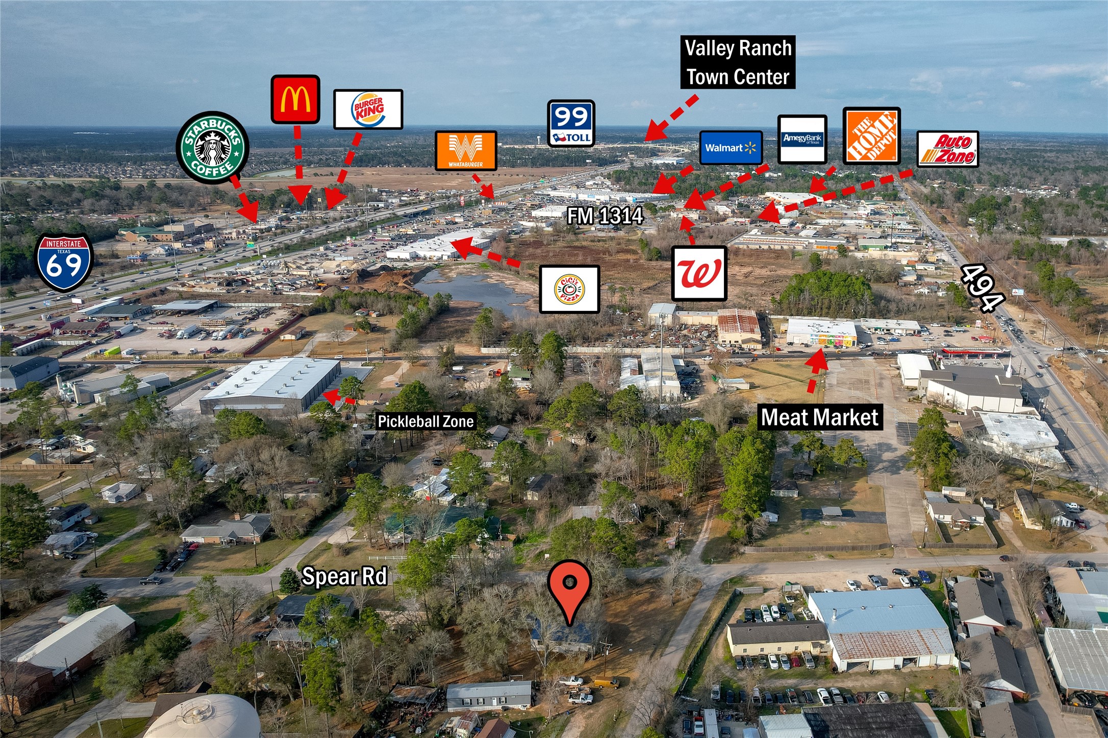 22094 Spear Road Porter, TX 77365 - Photo 3 of 45 This aerial photo highlights a residential area with nearby amenities, including popular retail stores, fast-food restaurants, and a shopping center. Major roads and highways provide convenient access to these locations, making it an ideal spot for those seeking proximity to essential services and dining options.
