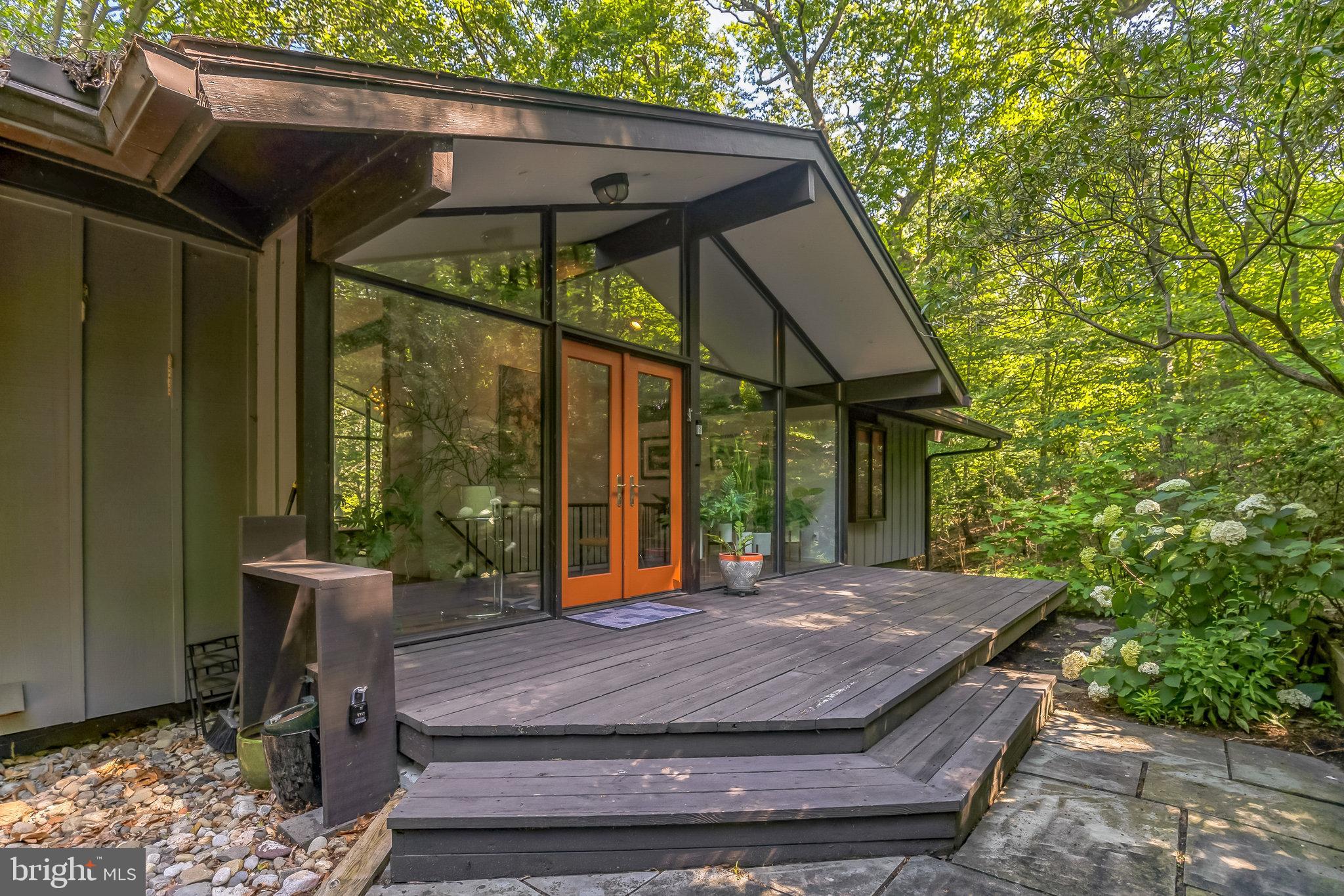 27 Forest View Road Rose Valley, PA 19086 - Photo 11 of 39 a wooden bench sitting in front of a building