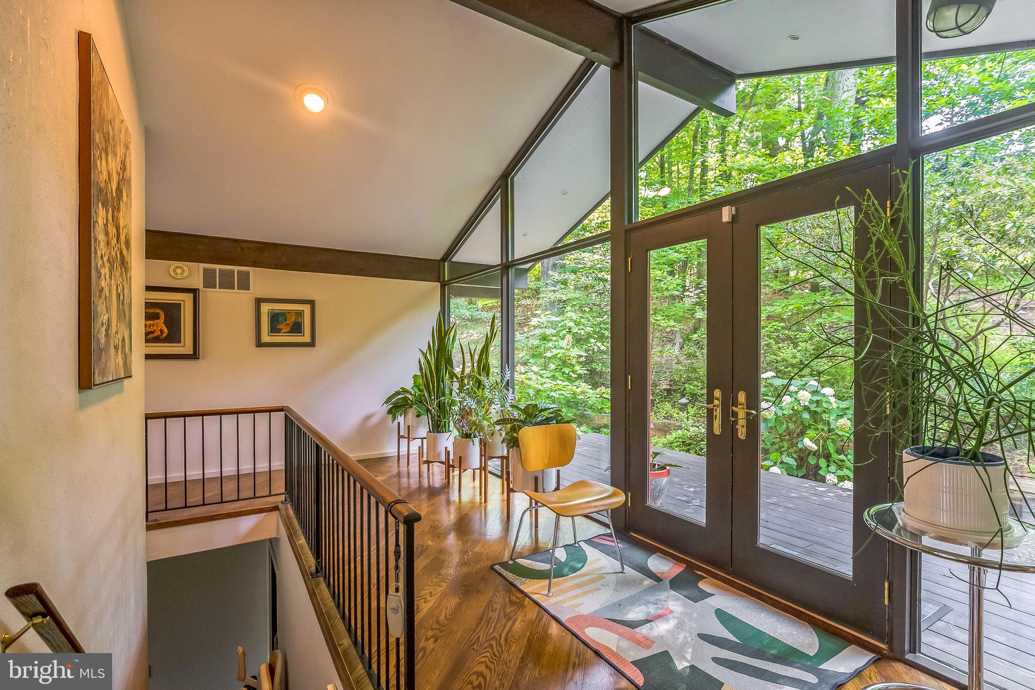 27 Forest View Road Rose Valley, PA 19086 - Photo 16 of 39 a balcony with furniture and wooden floor
