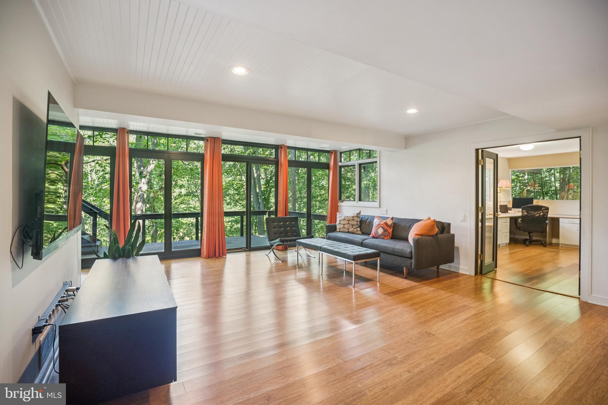 27 Forest View Road Rose Valley, PA 19086 - Photo 19 of 39 a living room with furniture and a large window