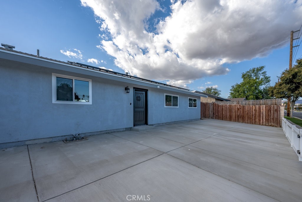1069 Erringer Road Simi Valley, CA 93065 - Photo 1 of 24 a view of a house with a wooden fence