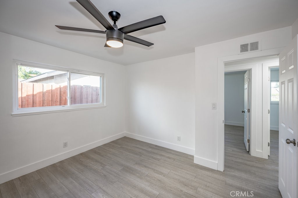 1069 Erringer Road Simi Valley, CA 93065 - Photo 12 of 24 wooden floor in an empty room with a window