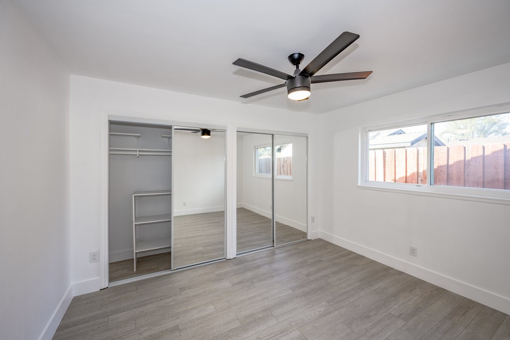 1069 Erringer Road Simi Valley, CA 93065 - Photo 13 of 24 a view of a livingroom with a ceiling fan and window
