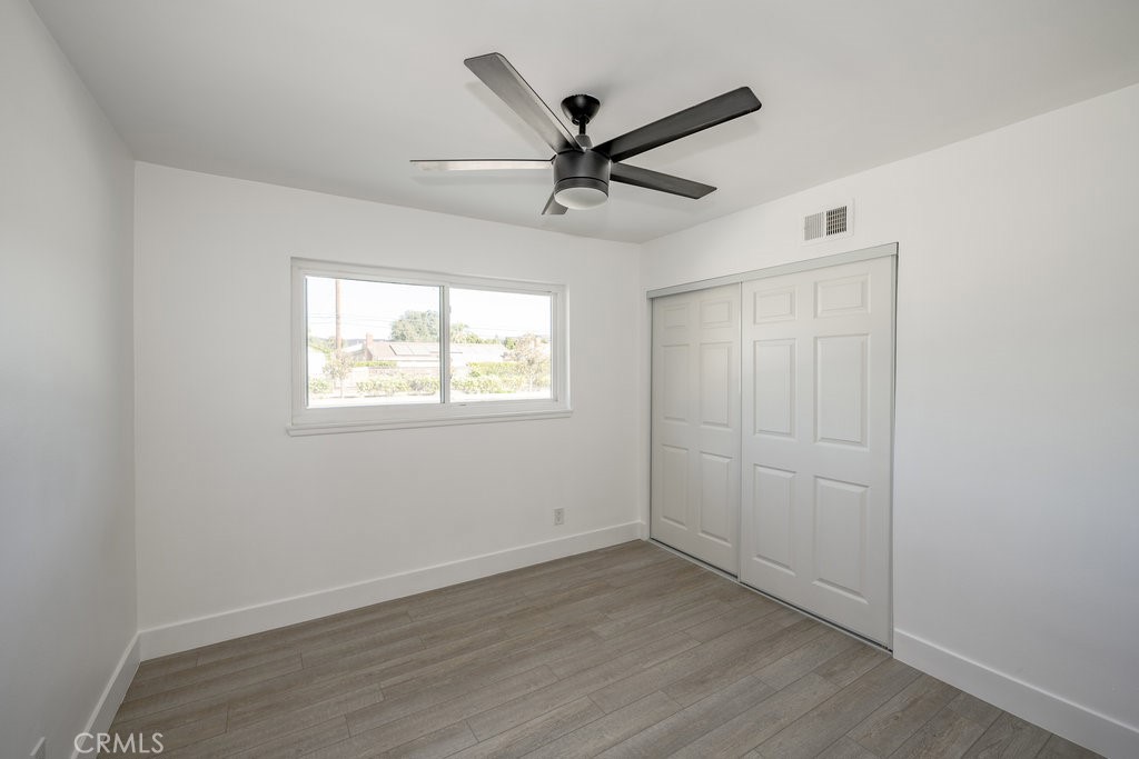 1069 Erringer Road Simi Valley, CA 93065 - Photo 15 of 24 an empty room with wooden floor and windows