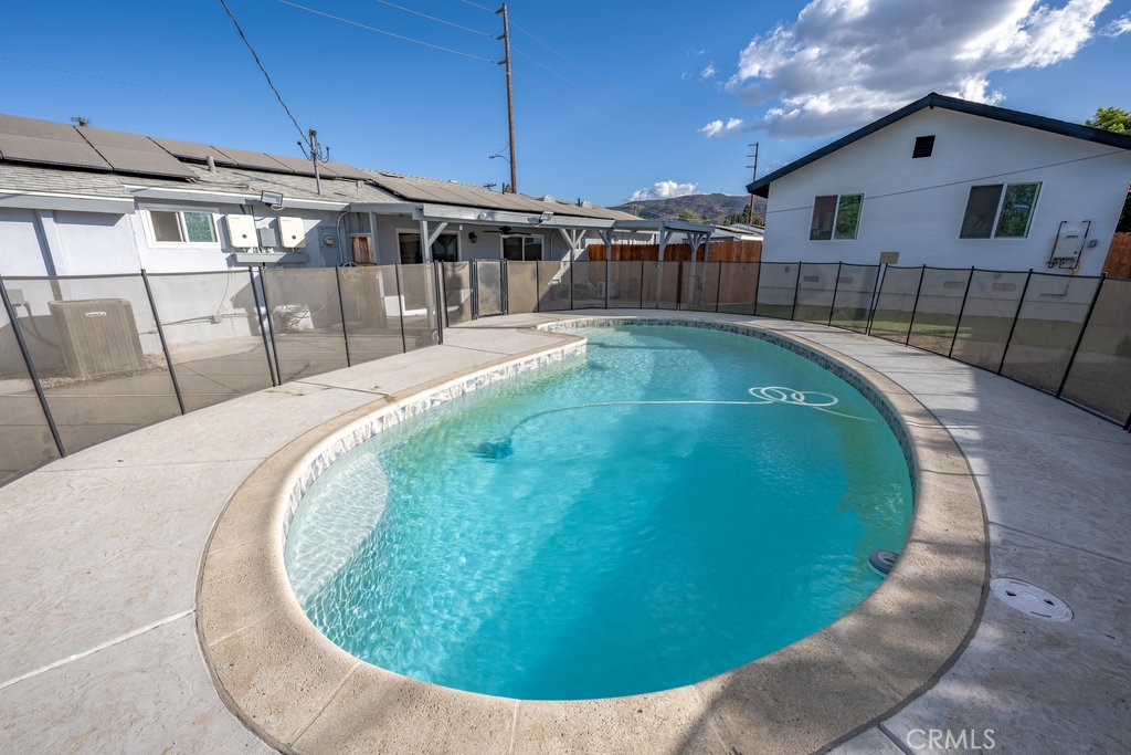 1069 Erringer Road Simi Valley, CA 93065 - Photo 23 of 24 a view of a swimming pool with a patio