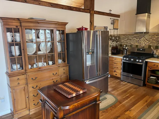 a kitchen with a stove and cabinets