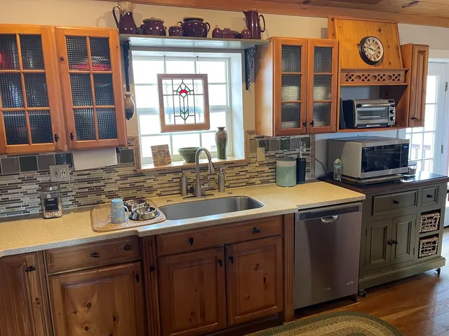 a close view of a stove top oven and sitting space
