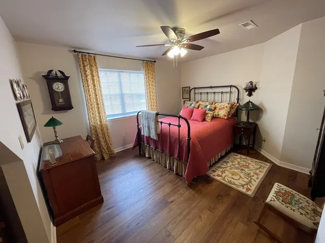 a bathroom with a toilet a sink and a mirror