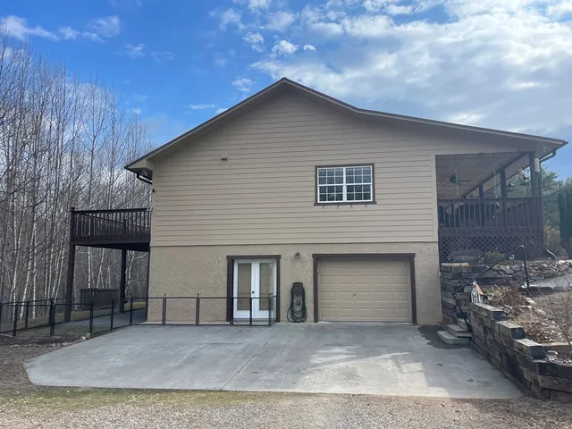 a front view of a house with a garage