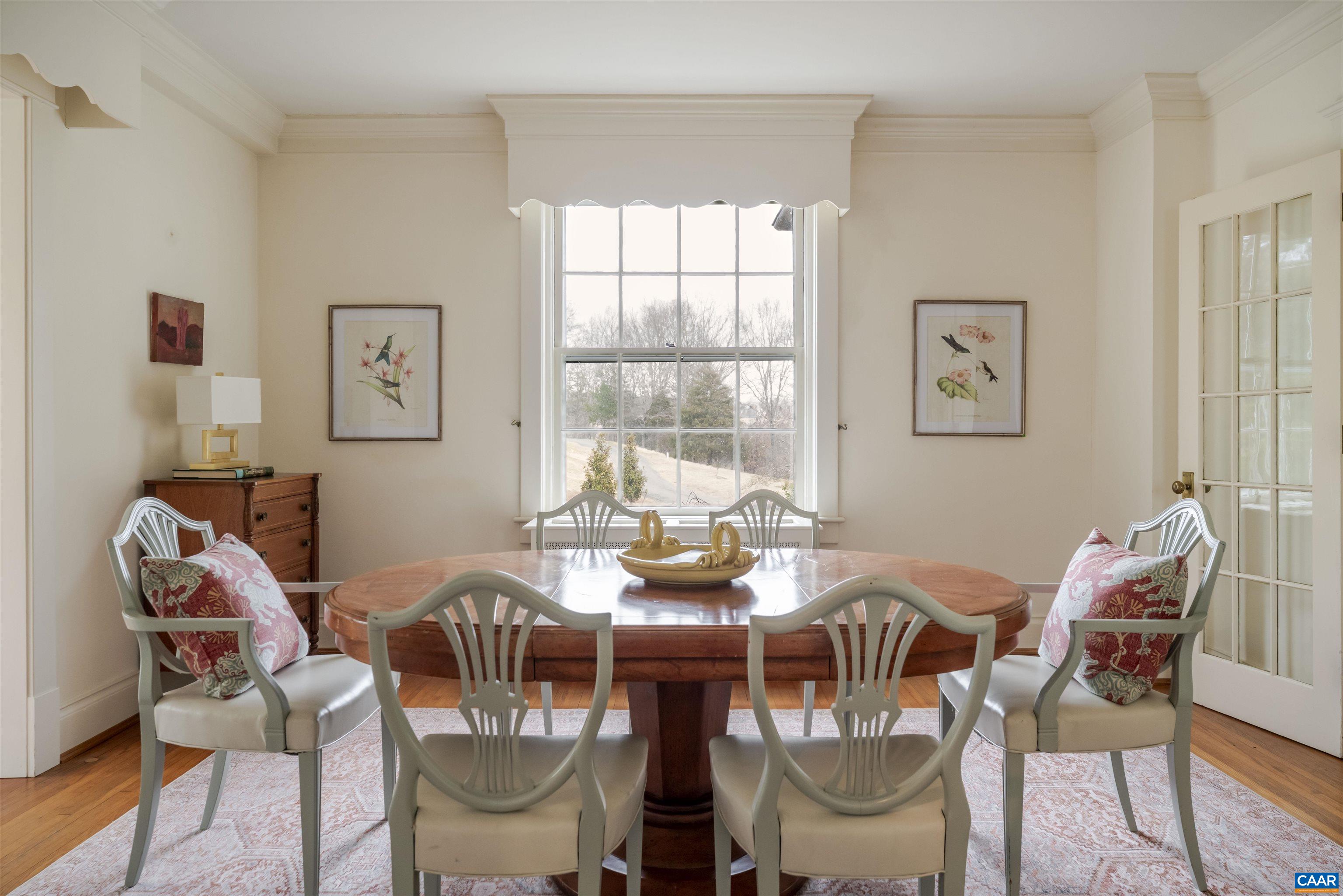 4035 Edge Valley Road North Garden, VA 22959 - Photo 16 of 57 a view of a dining room with furniture a rug and wooden floor