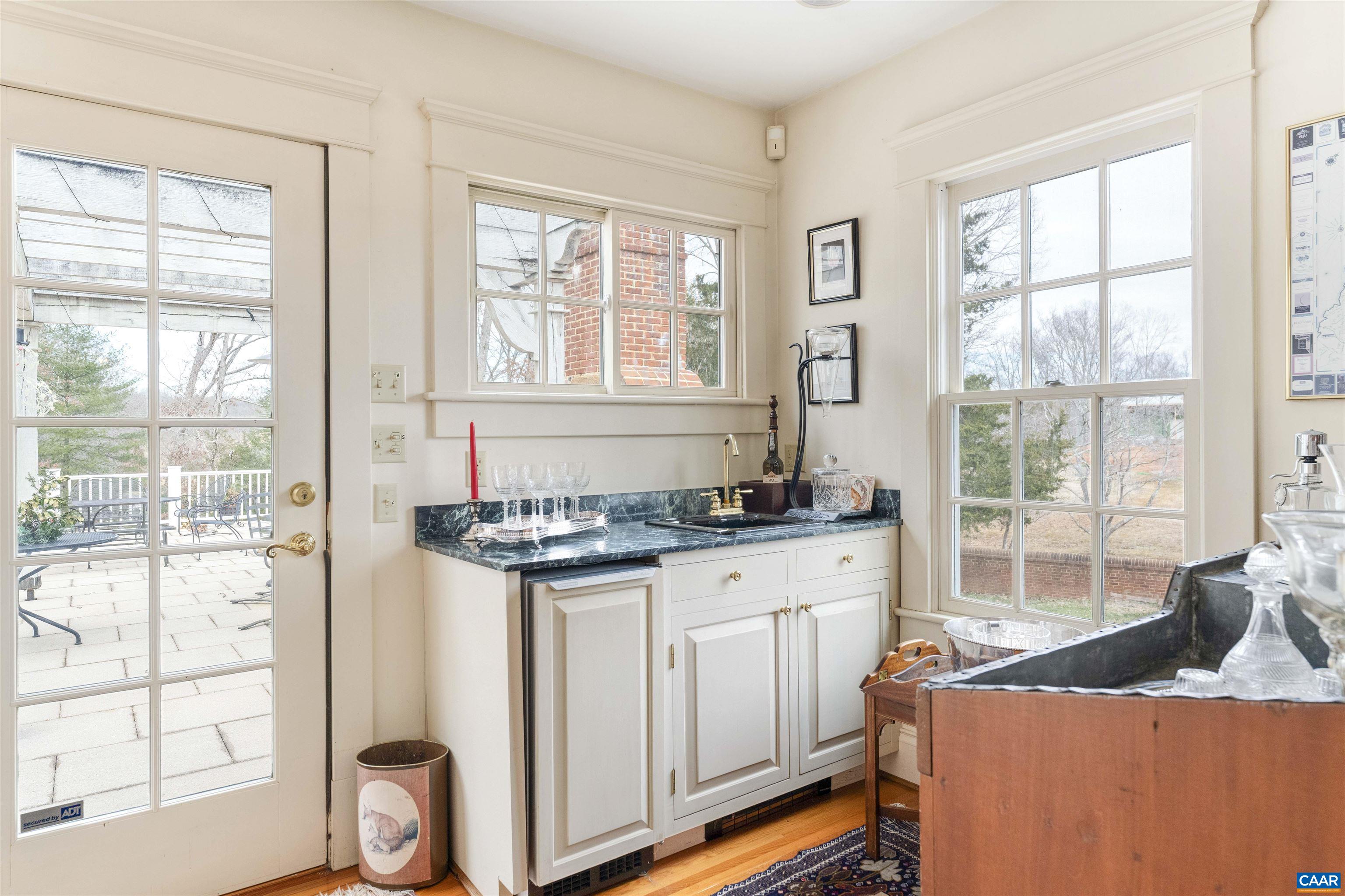 4035 Edge Valley Road North Garden, VA 22959 - Photo 18 of 57 a kitchen with stainless steel appliances granite countertop a stove a sink and a refrigerator with wooden floor