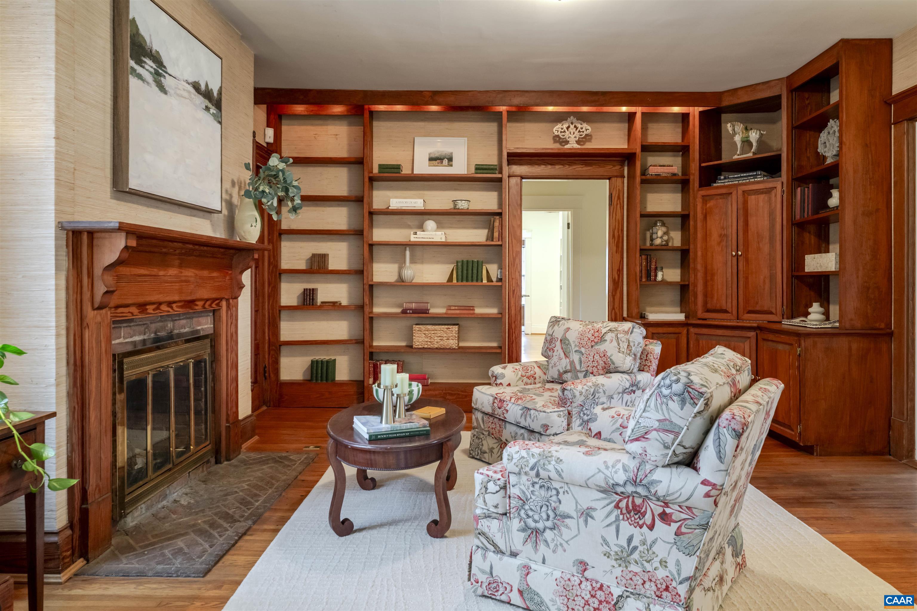 4035 Edge Valley Road North Garden, VA 22959 - Photo 19 of 57 a living room with furniture a fireplace and a flat screen tv