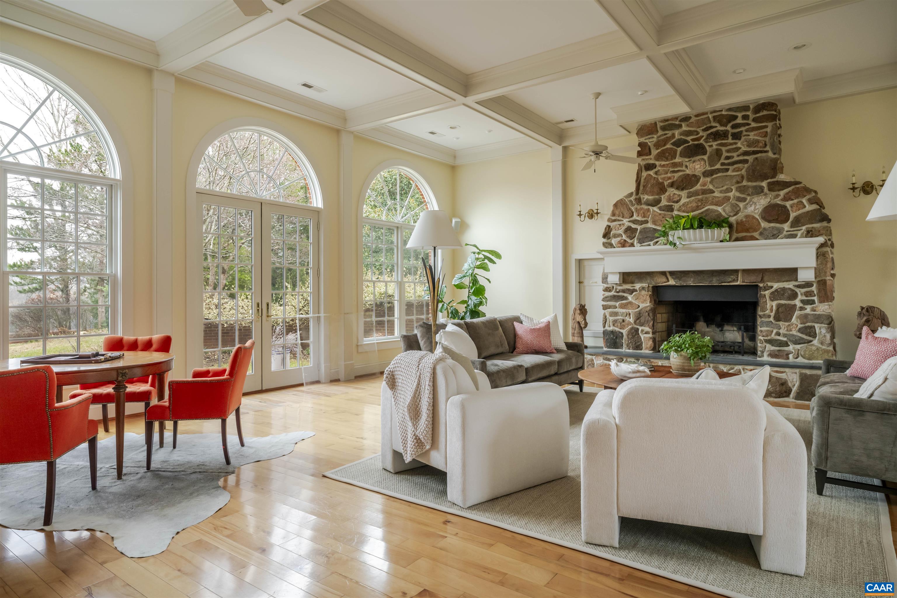 4035 Edge Valley Road North Garden, VA 22959 - Photo 22 of 57 a living room with furniture a fireplace and a floor to ceiling window