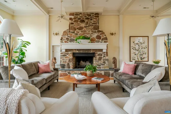 a outdoor dining room with furniture a couch and a potted plant