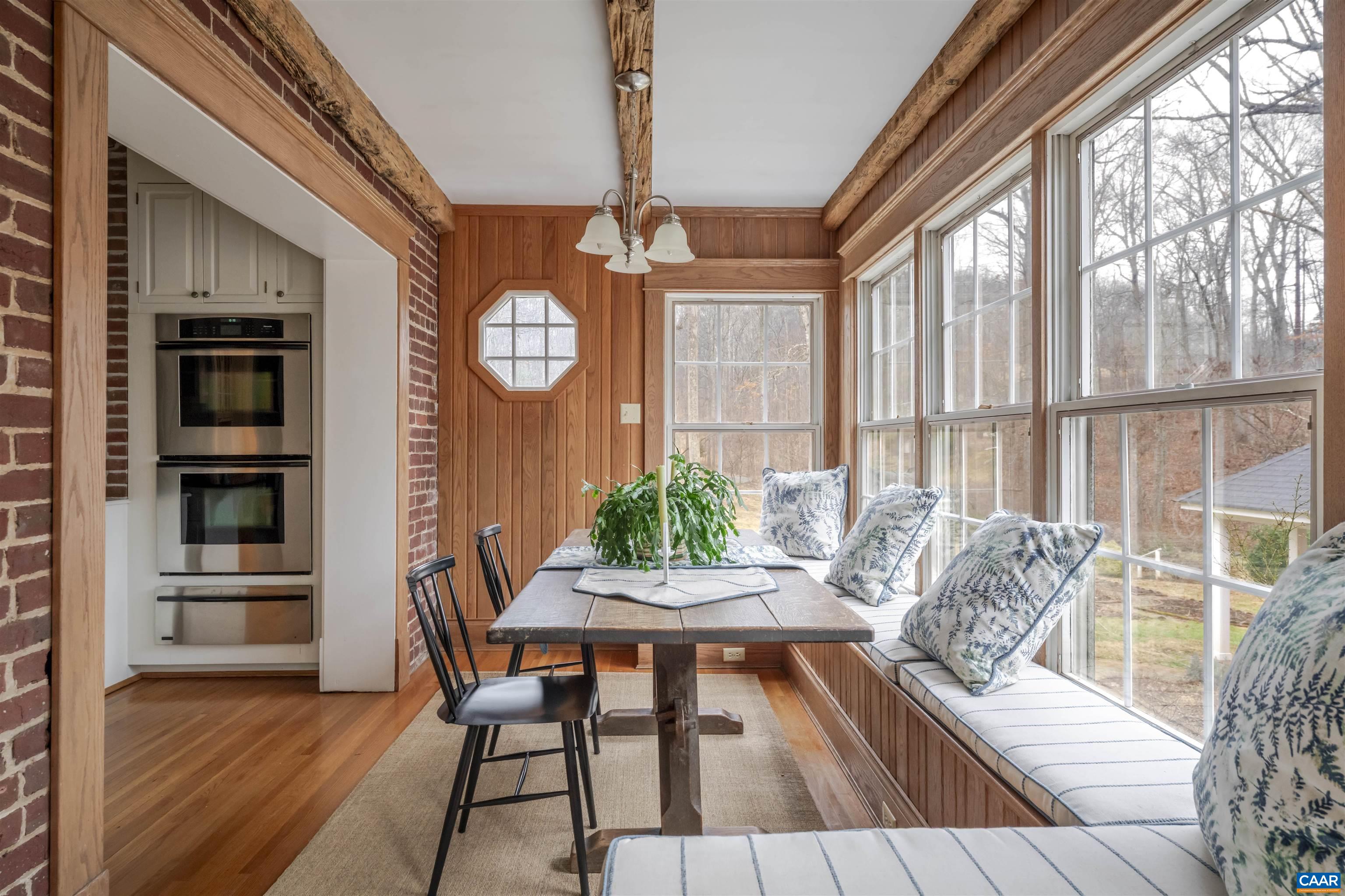 4035 Edge Valley Road North Garden, VA 22959 - Photo 30 of 57 a view of a dining room with furniture and a window