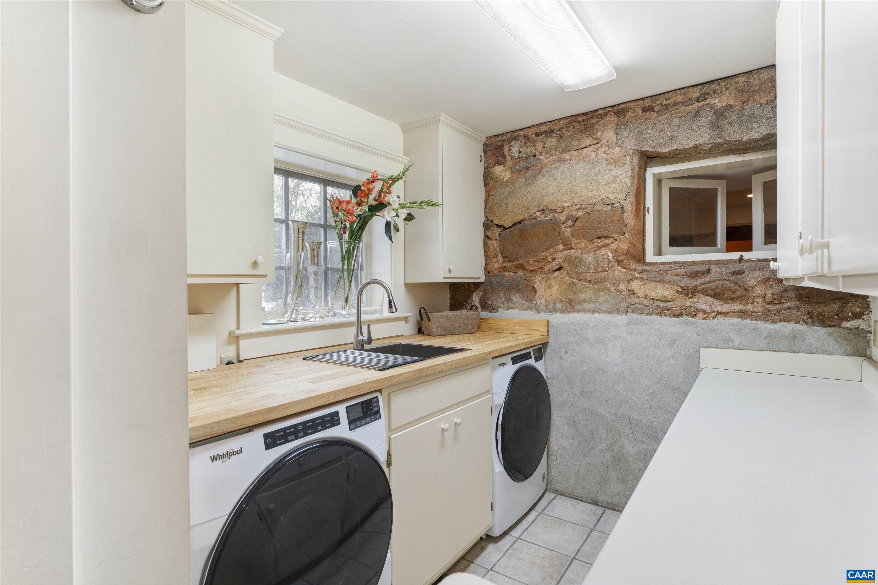 4035 Edge Valley Road North Garden, VA 22959 - Photo 52 of 57 a utility room with sink dryer and washer
