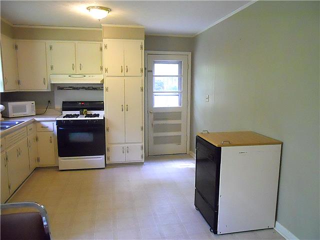 110 Cardinal Road Dickson, TN 37055 - Photo 8 of 20 a utility room with cabinets washer and dryer