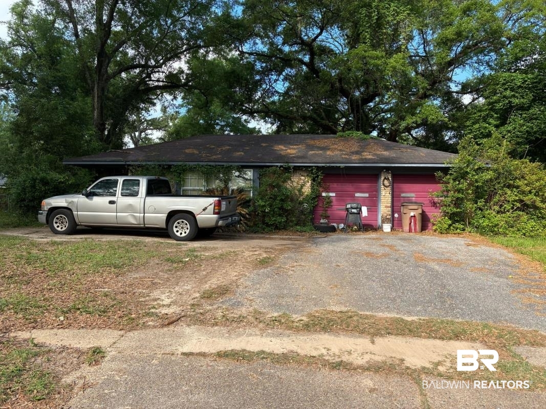 514 Nantucket Circle Mobile, AL 36609 - Photo 1 of 13 View of front of house featuring an attached garage and driveway