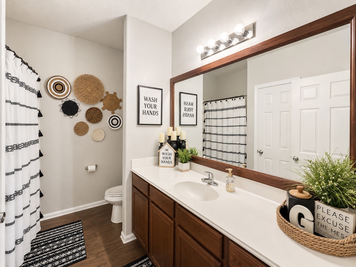 9911 Bronze Mill Lane Rosharon, TX 77583 - Photo 14 of 15 The full guest bathroom provides a long vanity and a practical layout designed to comfortably serve family and visitors.