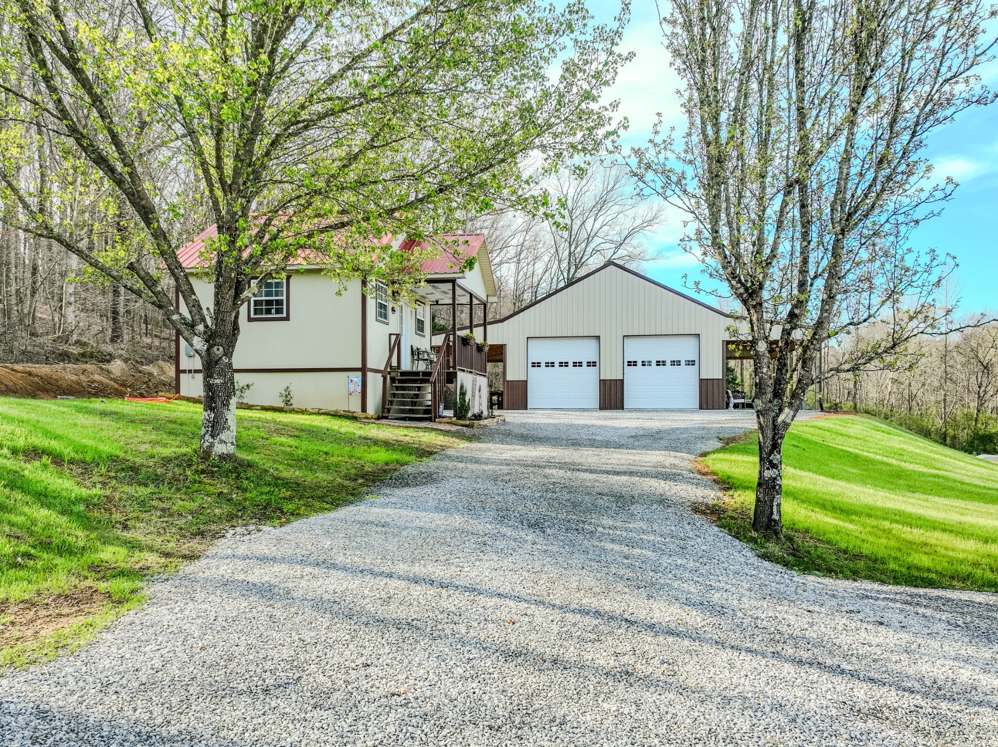 109 Rascal Town Road Loretto, TN 38469 - Photo 3 of 43 a front view of a house with garden