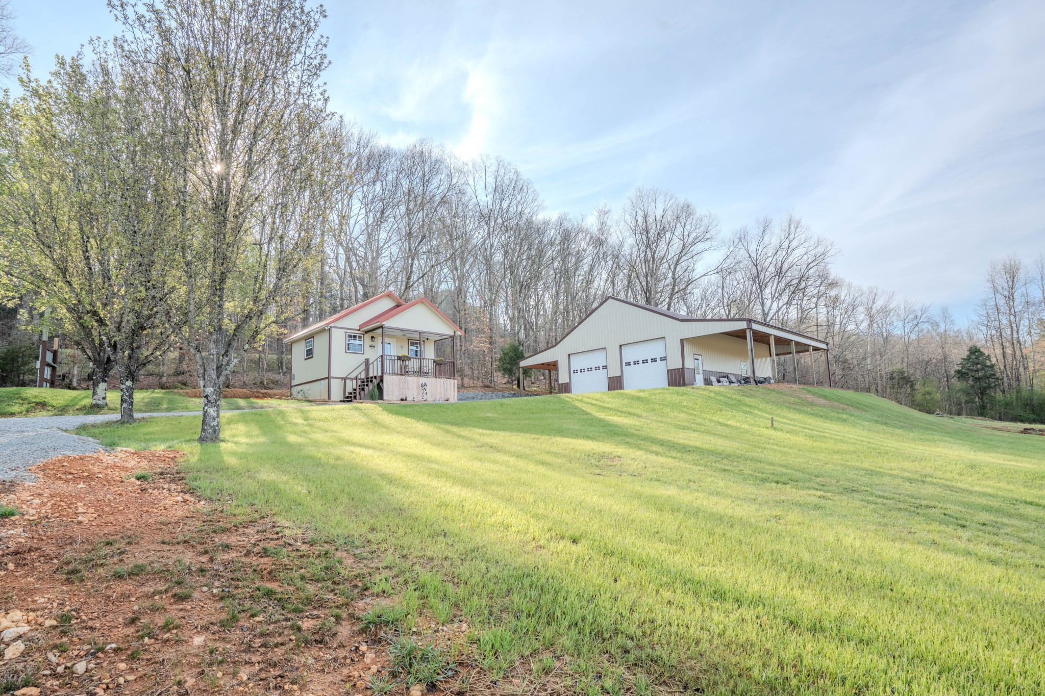 109 Rascal Town Road Loretto, TN 38469 - Photo 31 of 43 a view of a big house with a big yard and large trees