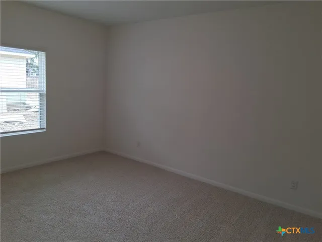 a bathroom with a sink double vanity granite and a mirror