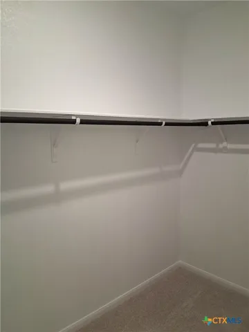 a view of house with backyard