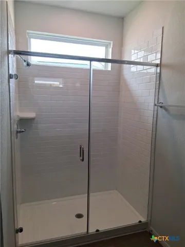 a view of house with backyard