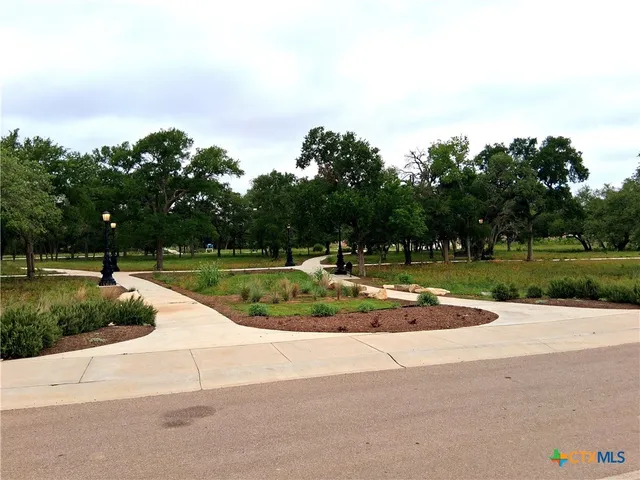 a view of house with outdoor seating area