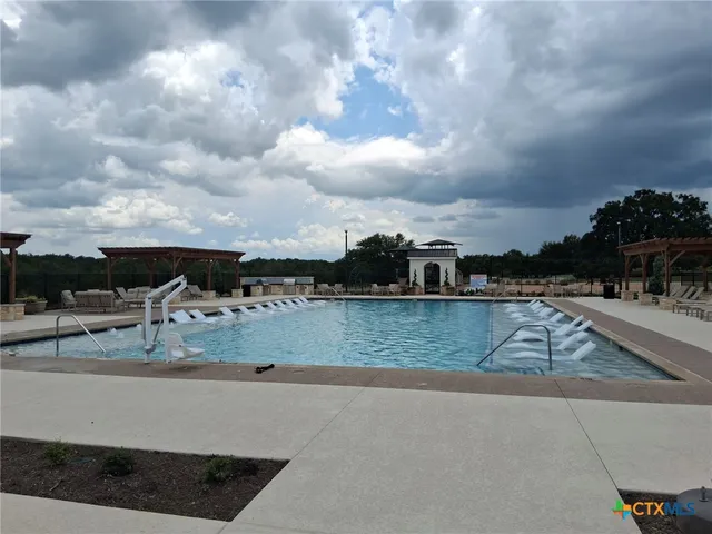 a view of a patio with a backyard