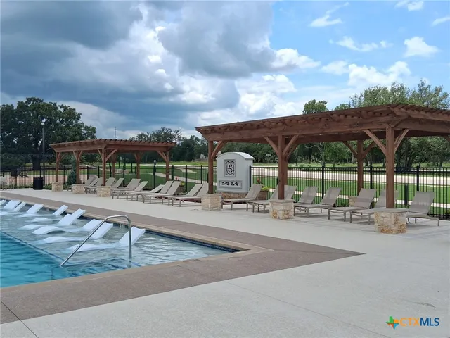 a terrace with a table and chairs