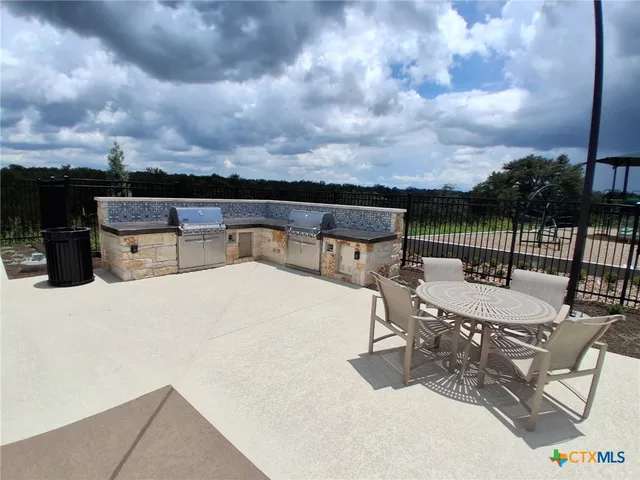 a view of a terrace with sitting area