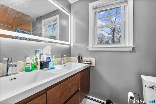 a bathroom with a sink and a mirror