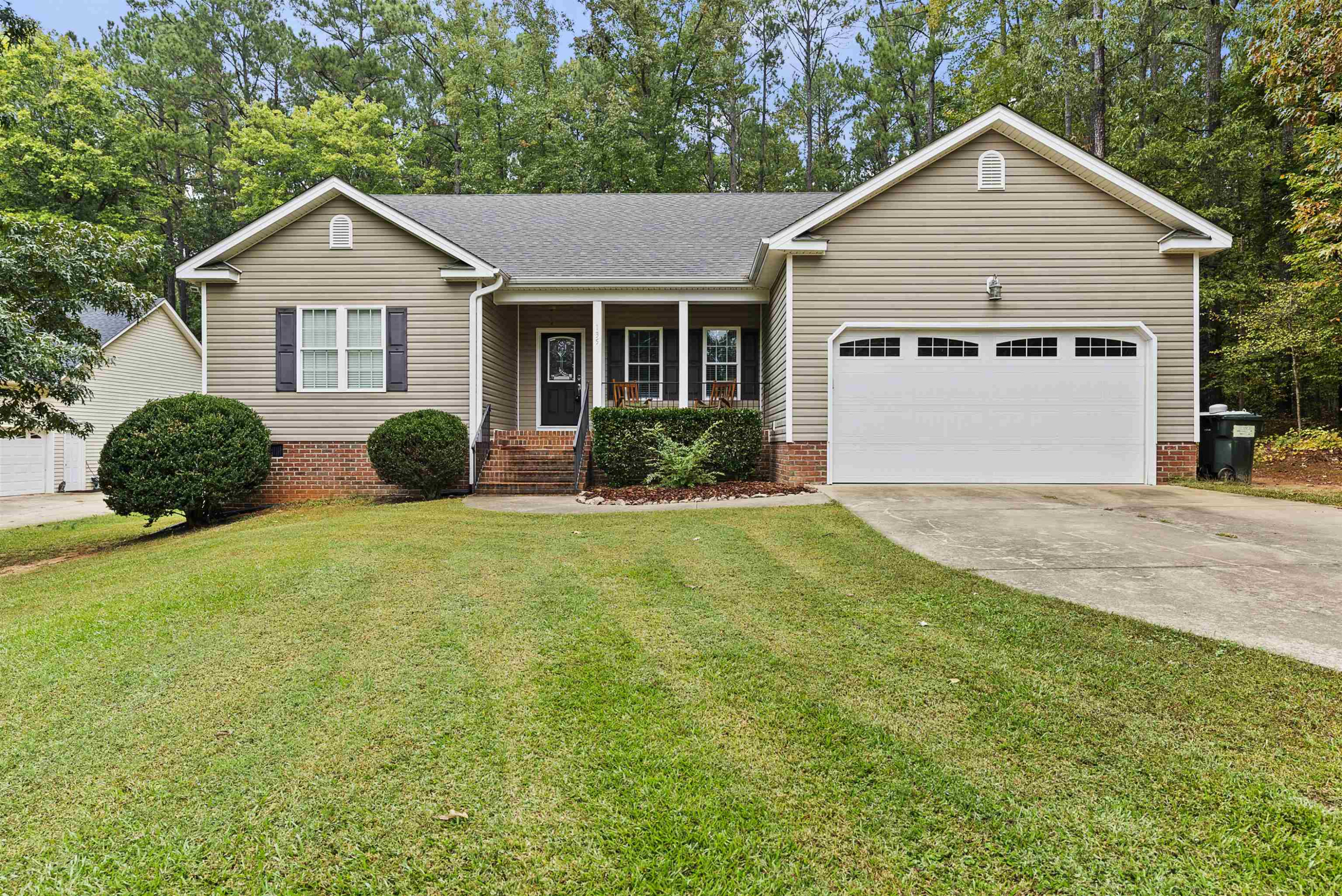 135 Rawhide Drive Spring Hope, NC 27882 - Photo 1 of 34 a front view of a house with yard and green space