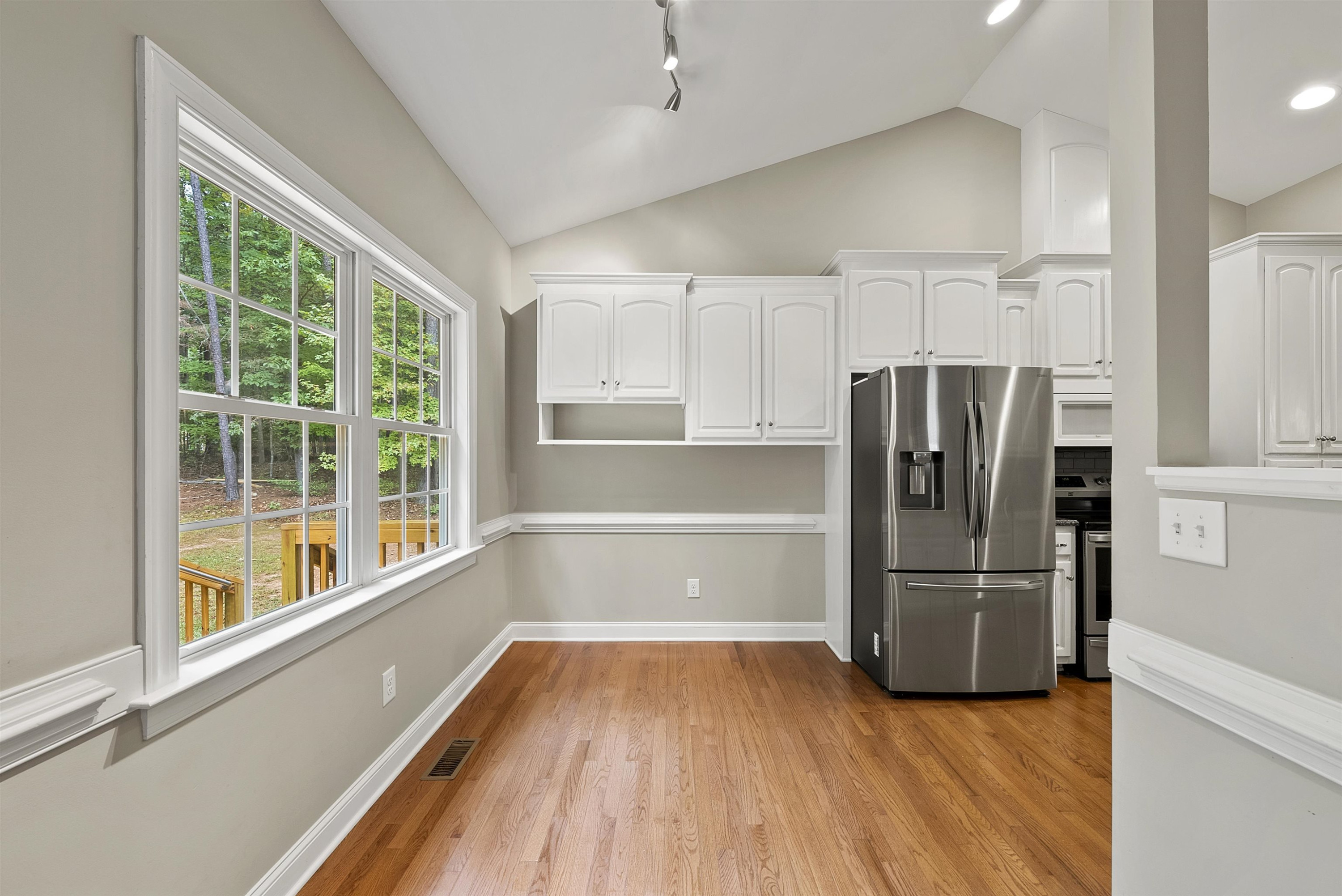 135 Rawhide Drive Spring Hope, NC 27882 - Photo 13 of 34 a kitchen with a refrigerator and a large window