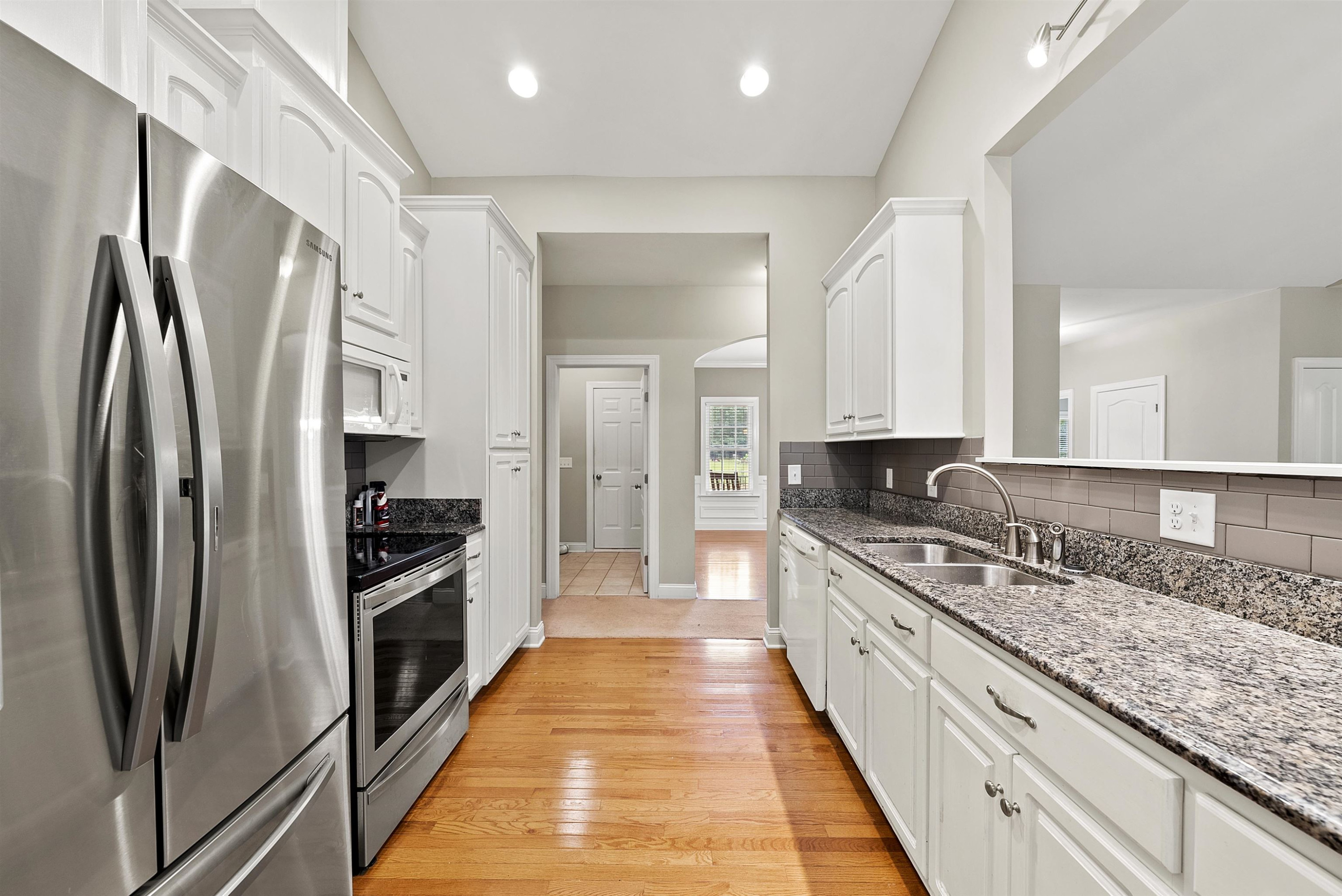 135 Rawhide Drive Spring Hope, NC 27882 - Photo 16 of 34 a large kitchen with stainless steel appliances granite countertop a refrigerator and a stove