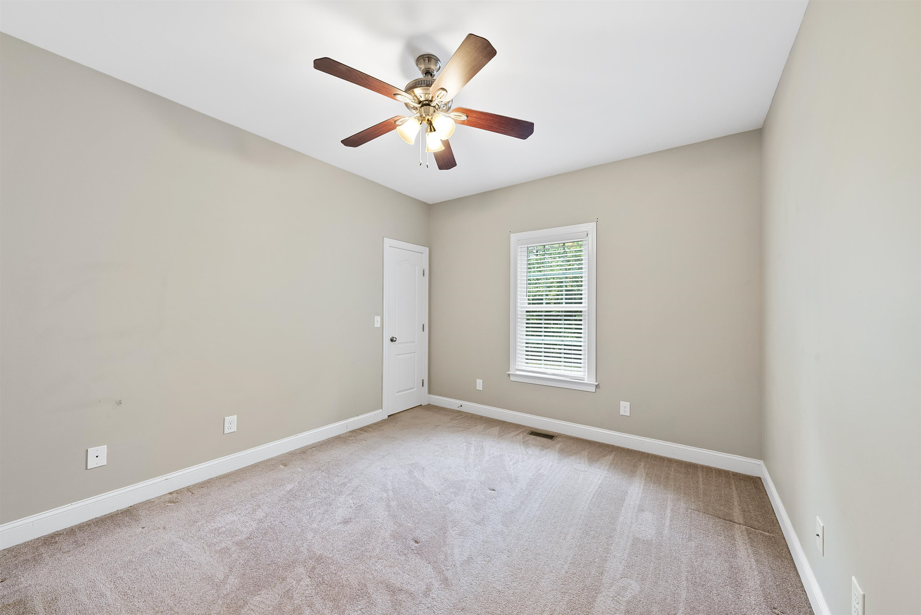135 Rawhide Drive Spring Hope, NC 27882 - Photo 26 of 34 an empty room with ceiling fan and window
