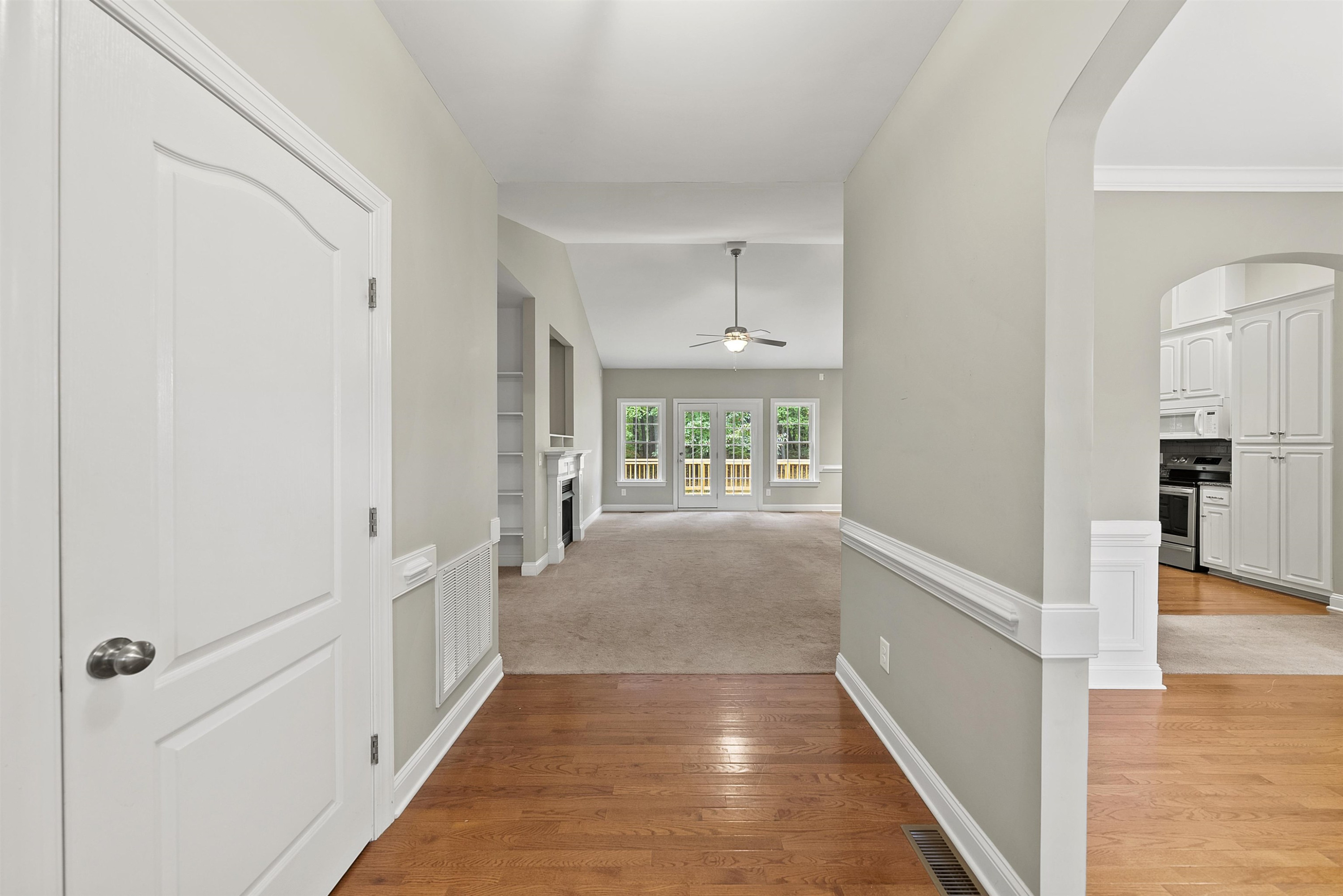 135 Rawhide Drive Spring Hope, NC 27882 - Photo 4 of 34 a view of a hallway with wooden floor and staircase