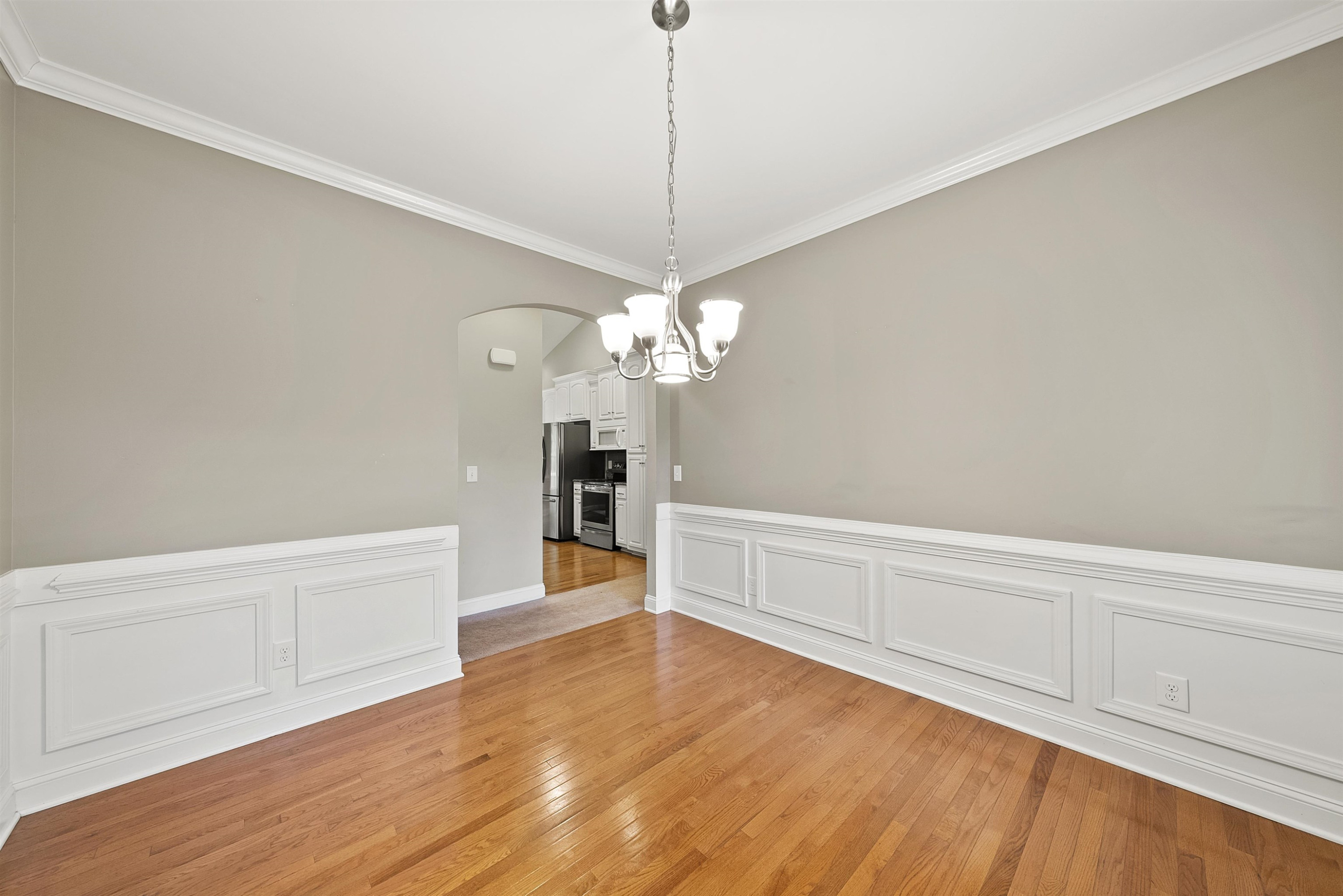 135 Rawhide Drive Spring Hope, NC 27882 - Photo 6 of 34 a view of a room with wooden floor and chandelier