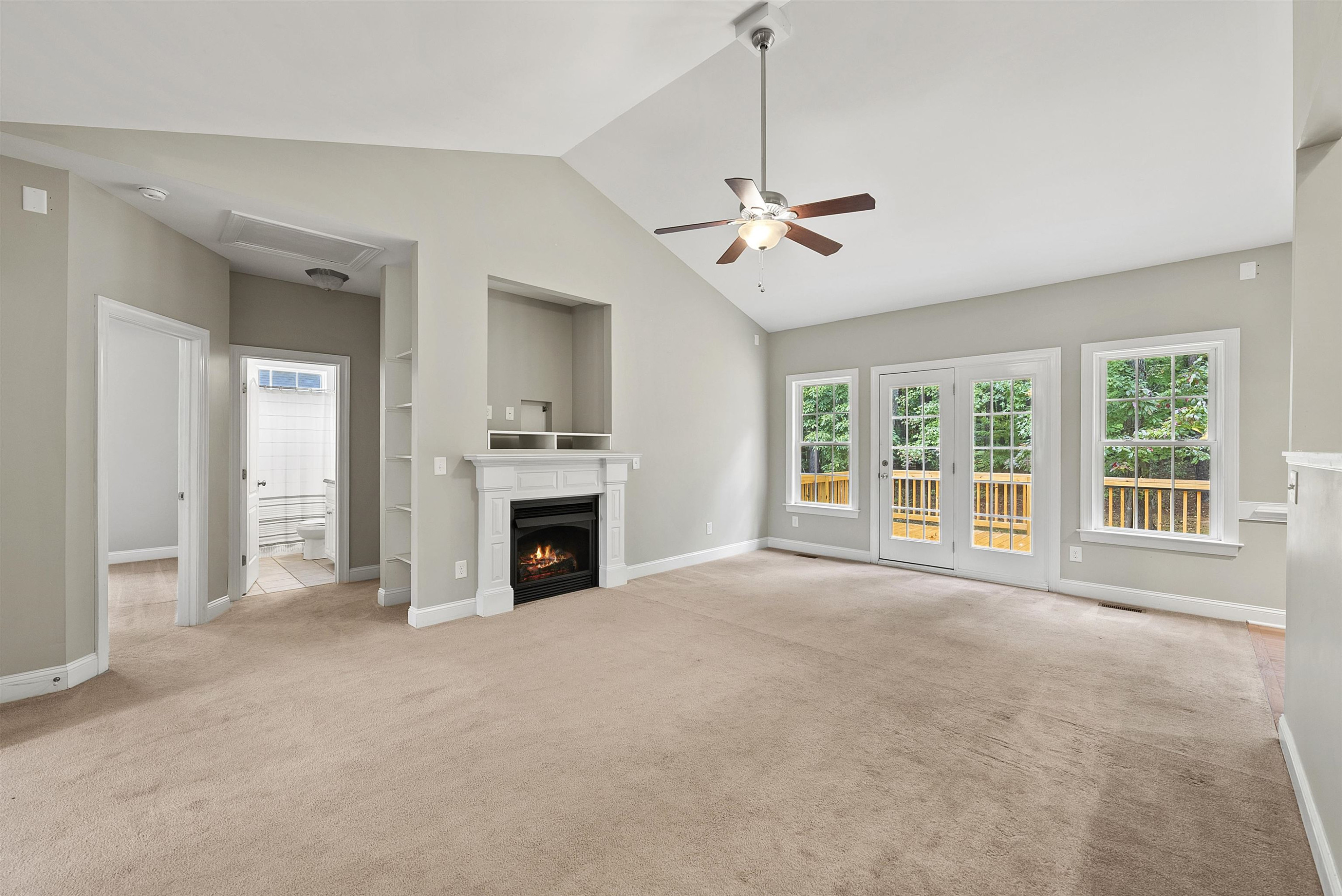 135 Rawhide Drive Spring Hope, NC 27882 - Photo 10 of 34 a view of an empty room with a fireplace and a window