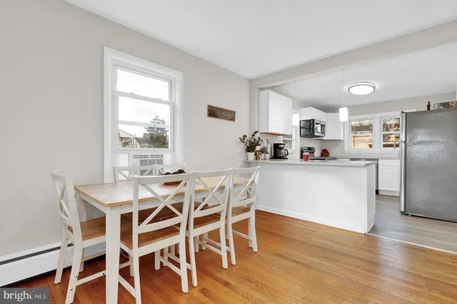 a kitchen with sink a stove and cabinets