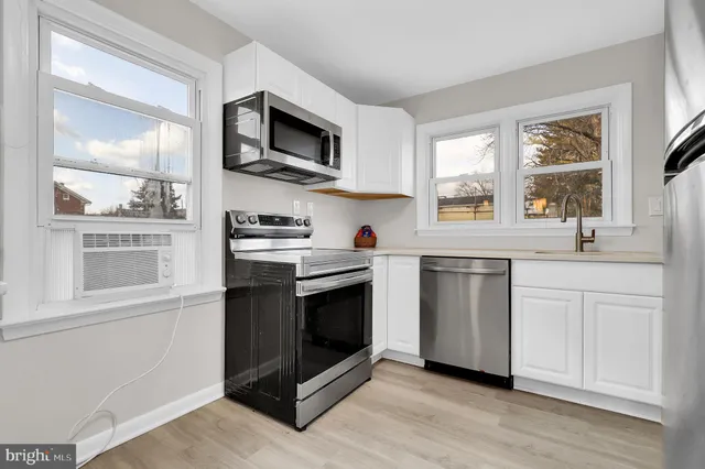 a room with a sink and a mirror