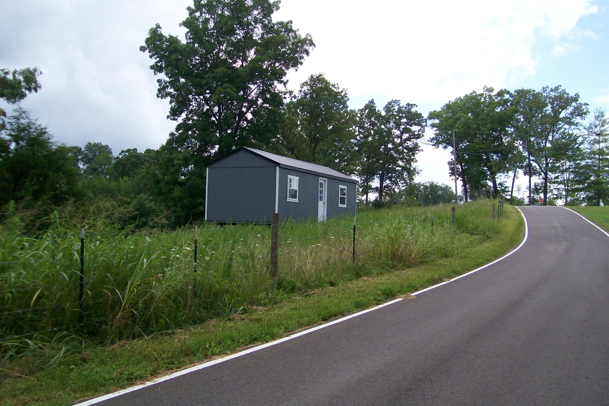 0 Sparkman Town Road Rock Island, TN 38581 - Photo 13 of 13 a view of a house with a yard and potted plants