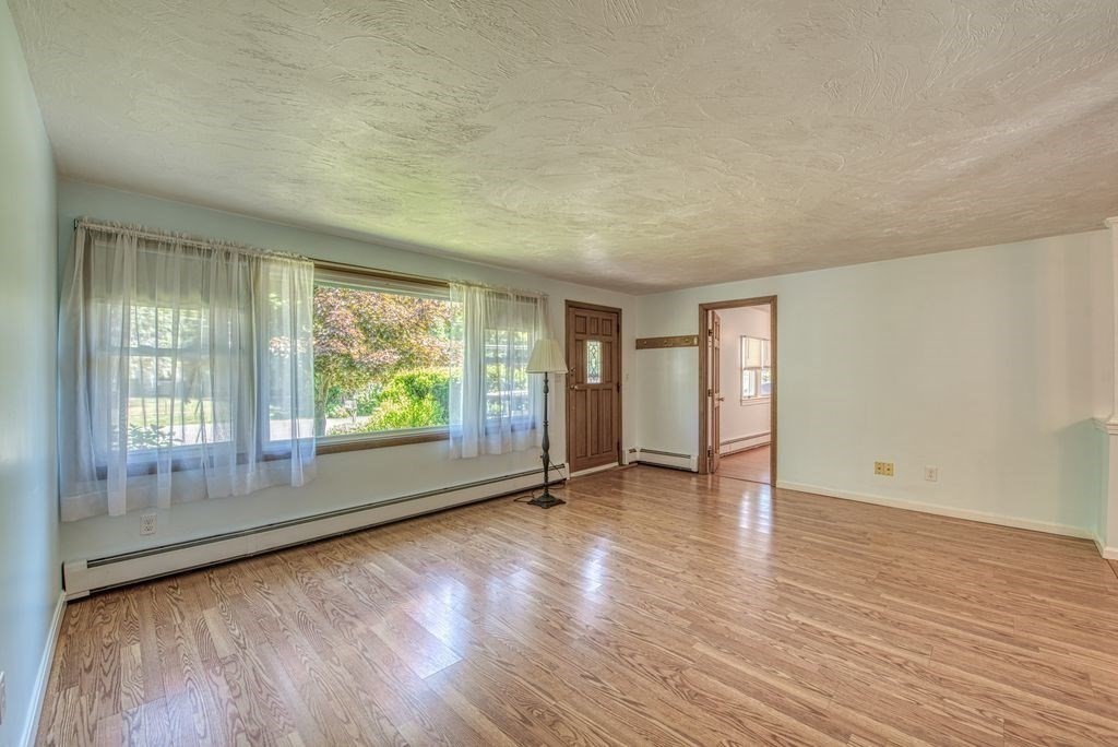 81 Errol Road Brockton, MA 02302 - Photo 8 of 31 wooden floor in an empty room with a window
